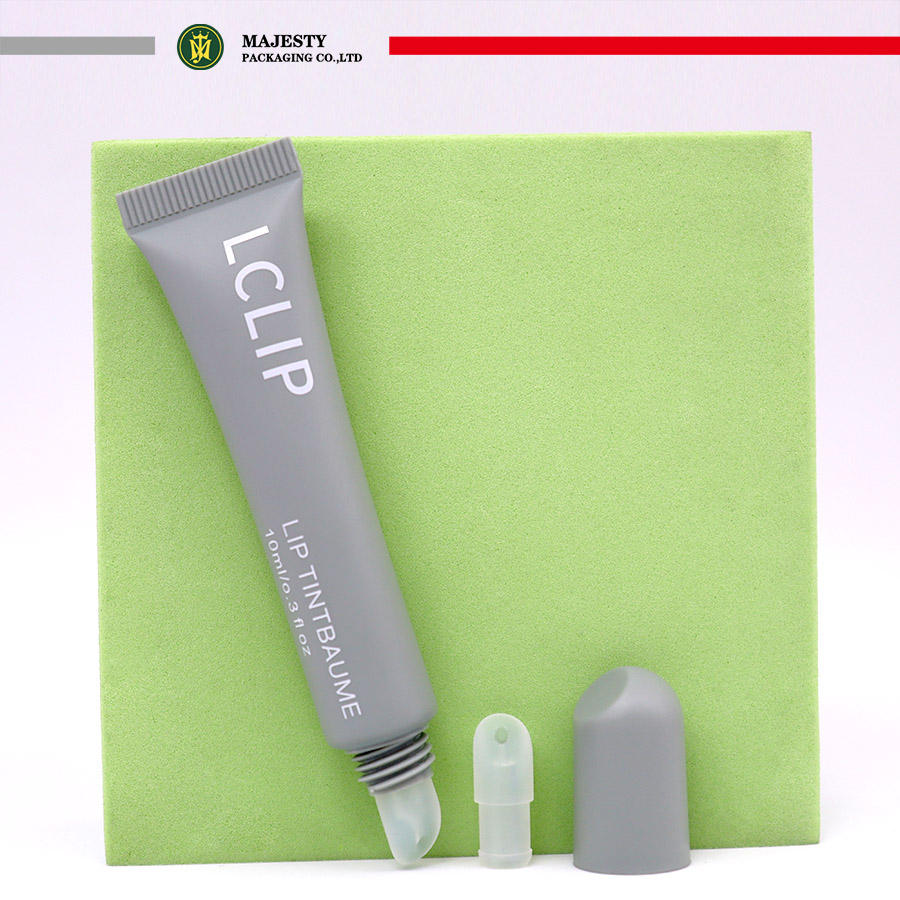 تصنيع المعدات الأصلية وتصنيع التصميم الشخصي صغيرة صغيرة 10 مللي أنابيب بلاستيكية ناعمة PE مع طرف سيليكون طرف PE ملمع الشفاه عصا الشفاه بلسم الضغط تصميم